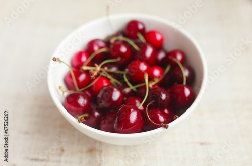 Fresh red cherries in bowl