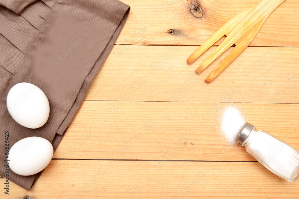 Hat cooking, eggs, wooden fork and salt Hat cooking, eggs, wooden fork and salt