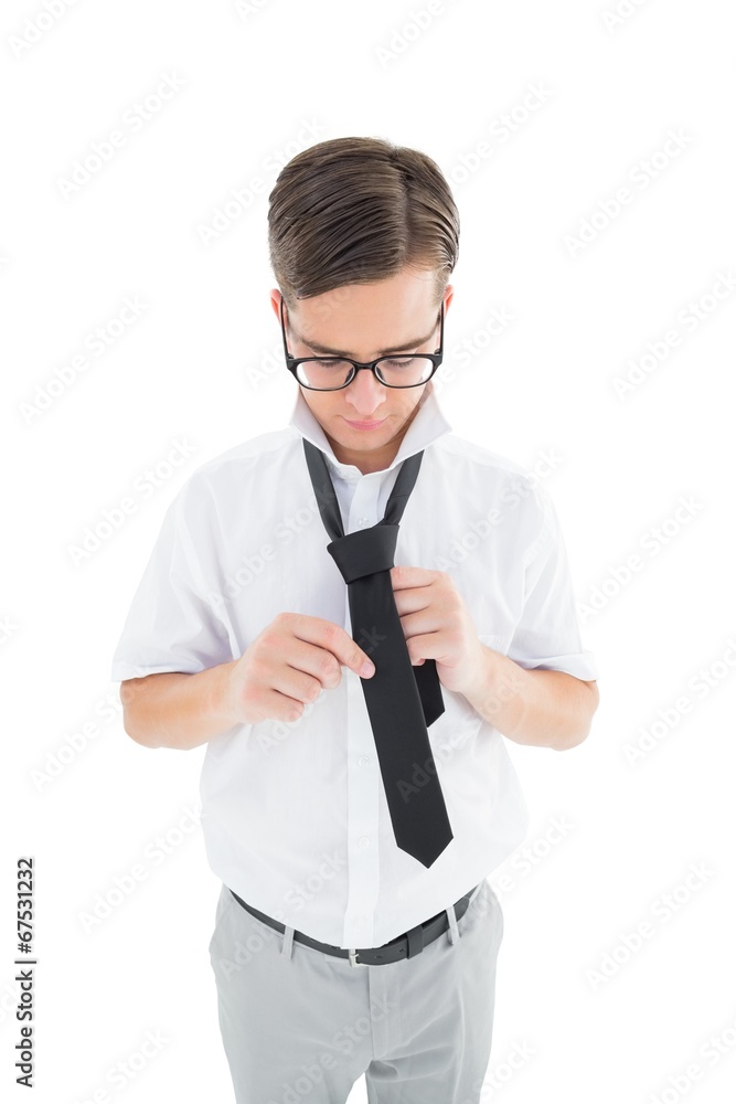 Geeky hipster fixing his tie