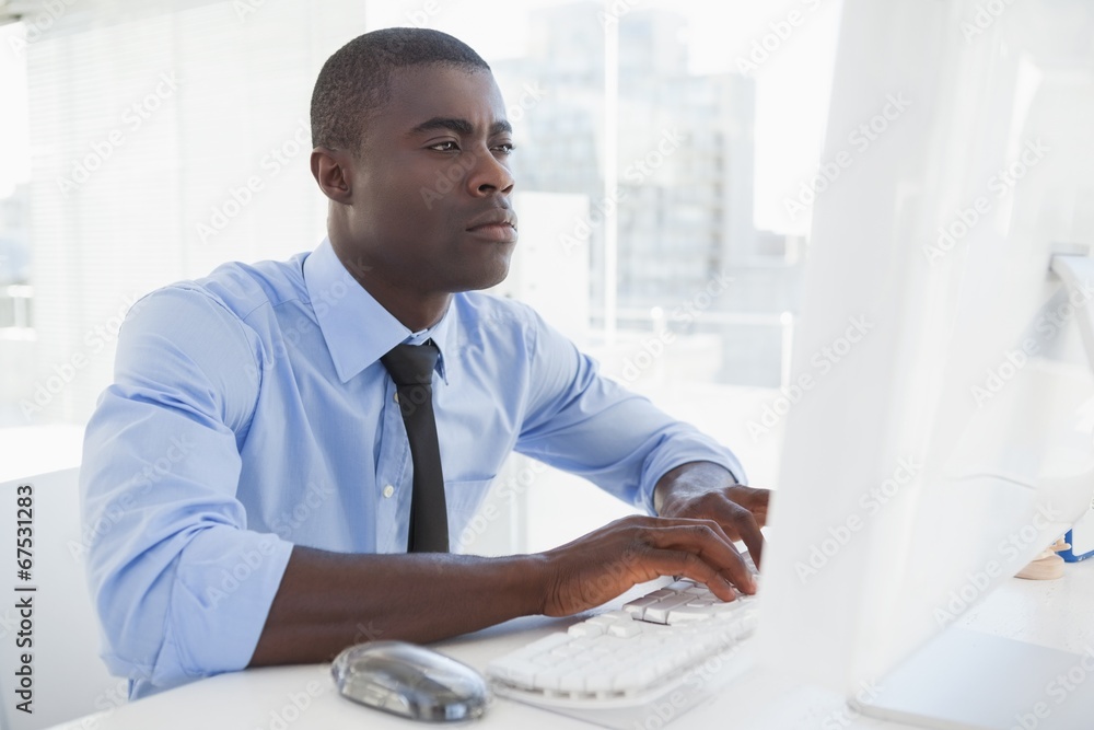 Fototapeta premium Focused businessman working at his desk