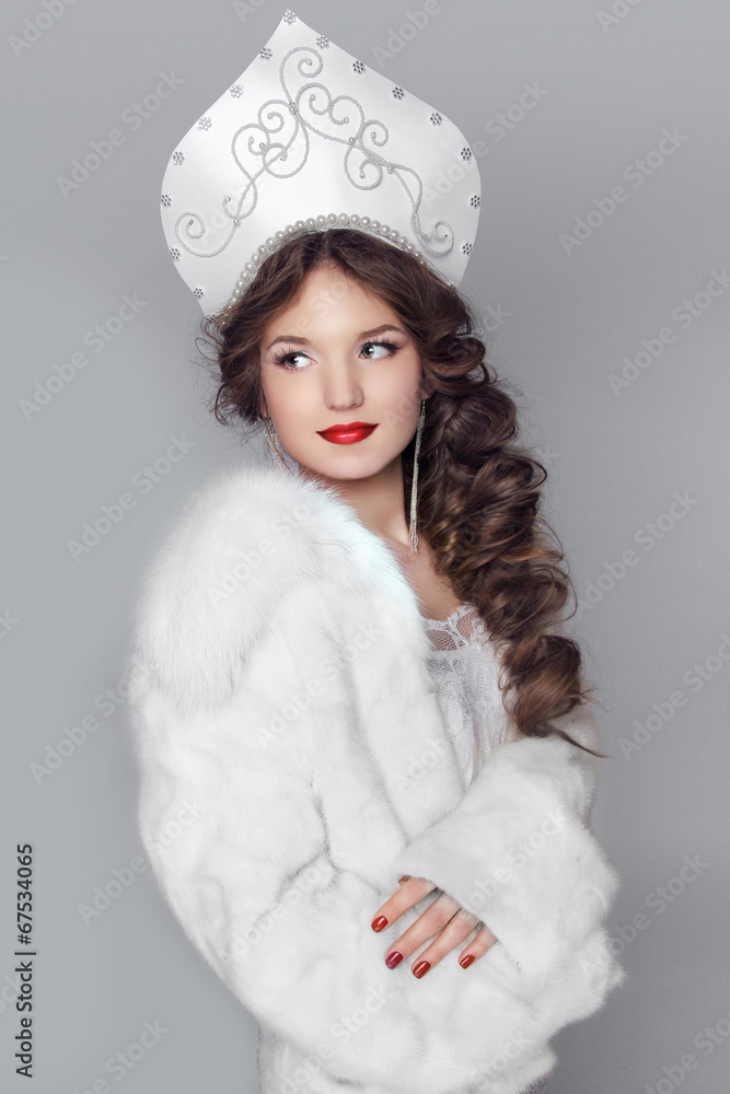 Fashion girl in fur coat and exclusive design clothes on manners Fashion girl in fur coat and exclusive design clothes on manners