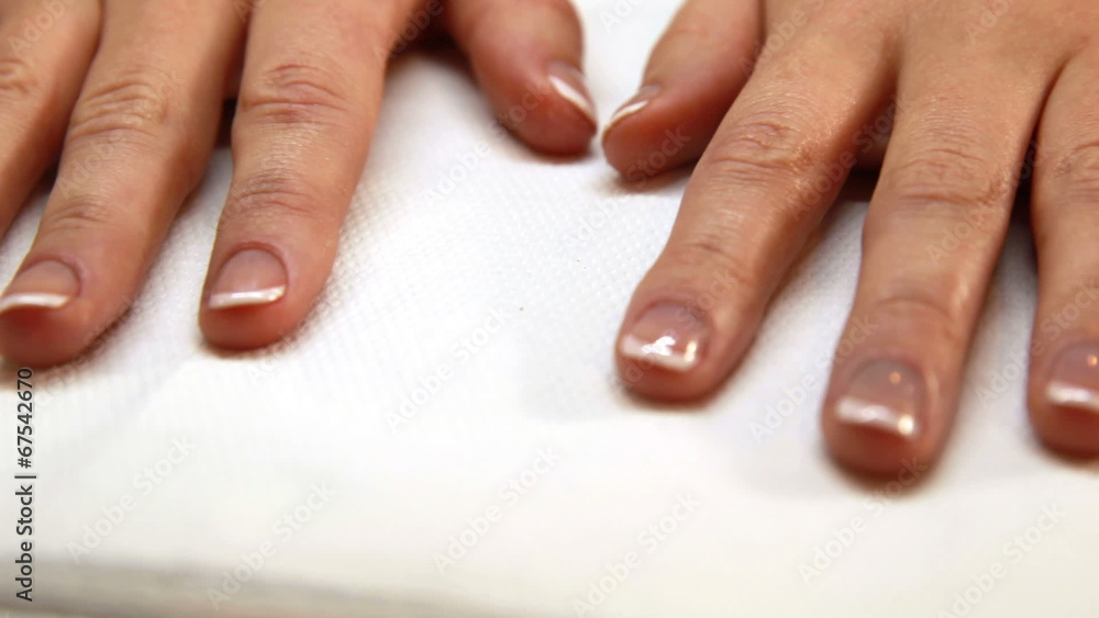 Hands showing fresh french manicure Hands showing fresh french manicure