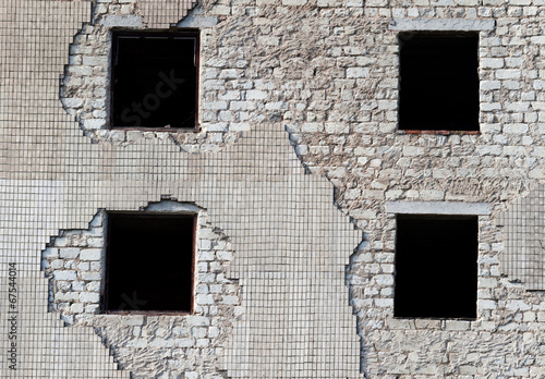 Wall of old destroyed house photo