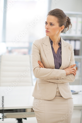 Portrait of thoughtful business woman in office Free Download Portrait of thoughtful business woman in office - GFXLoad