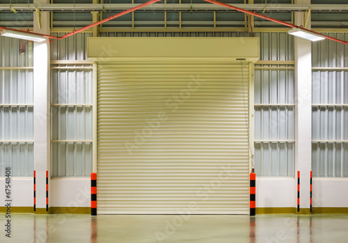 Roller door or roller shutter. Also called security door or security shutter with automatic system. For protection residential and commercial building i.e. house  warehouse  factory  shop and store.