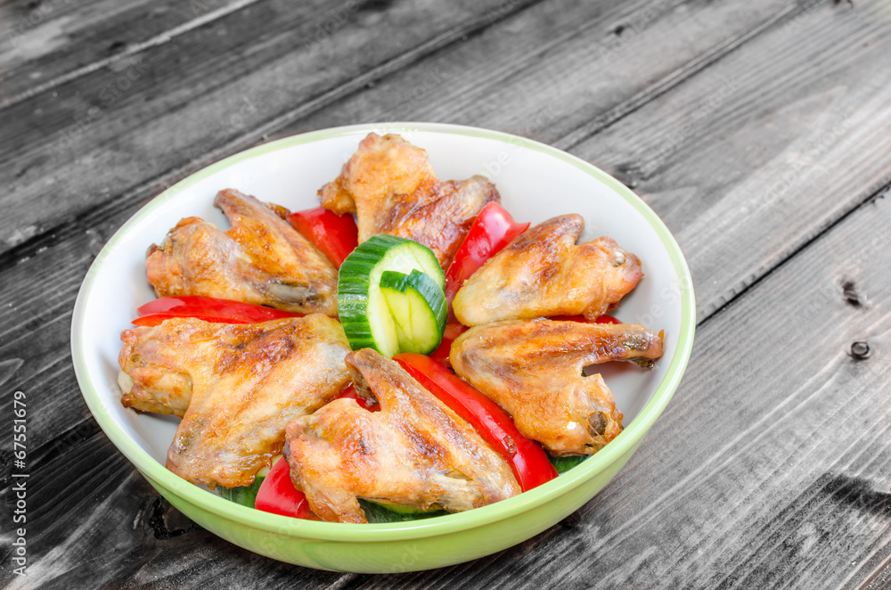 Chicken wings baked with vegetable Chicken wings baked with vegetable