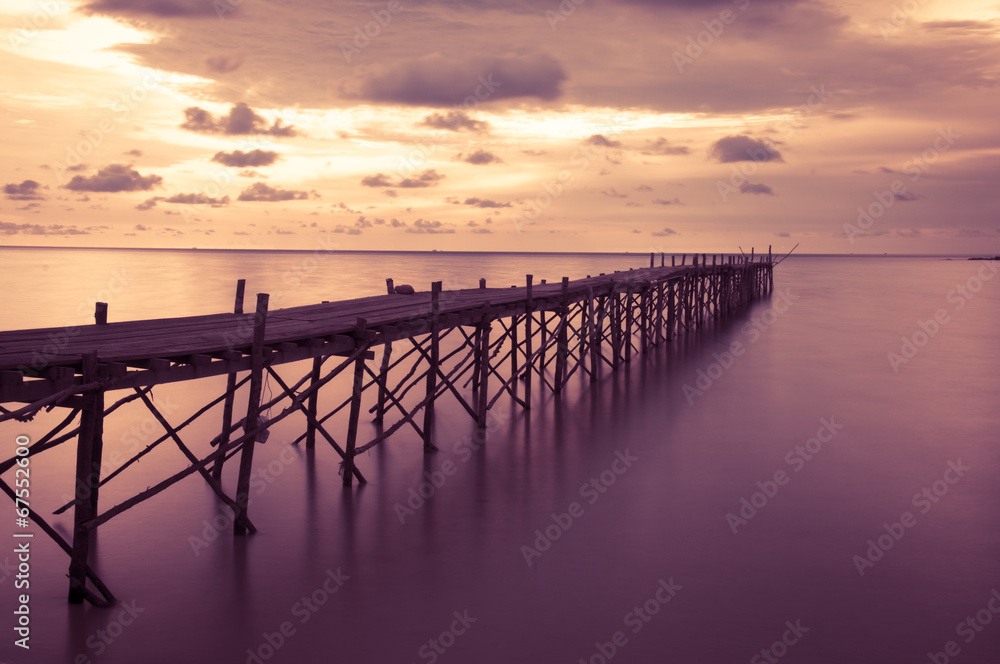 Fototapeta premium Wooden beach pier with color filter effect