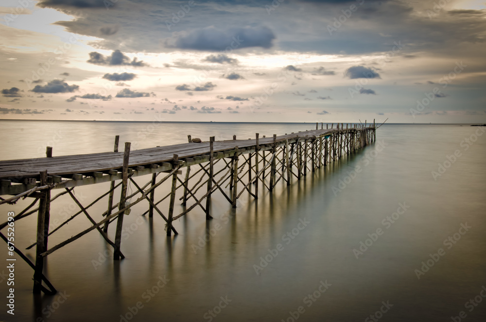 Fototapeta premium Wooden beach pier with color filter effect