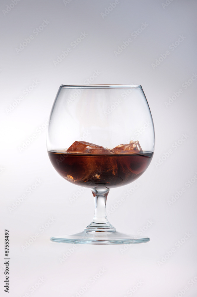 Glass being filled with cola Glass being filled with cola