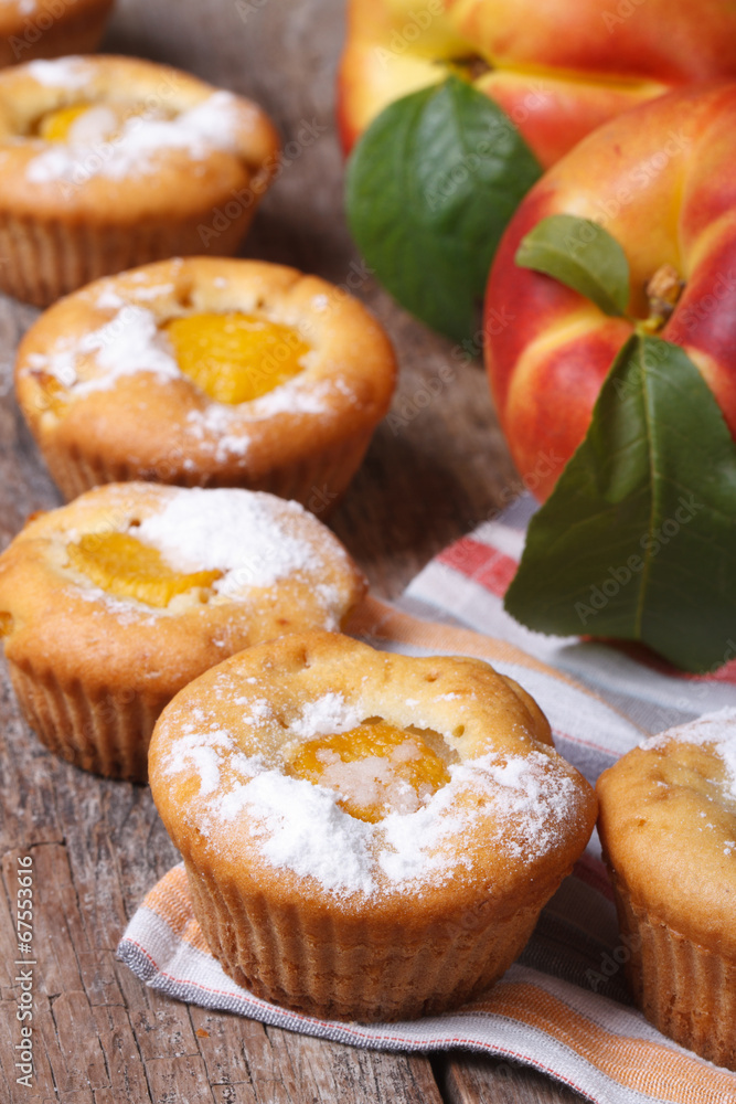 fresh peach muffins sprinkled with powdered sugar fresh peach muffins sprinkled with powdered sugar