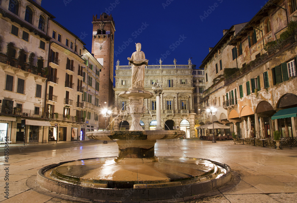 Verona - Fountain on Piazza Erbe in dusk and Porta Leona