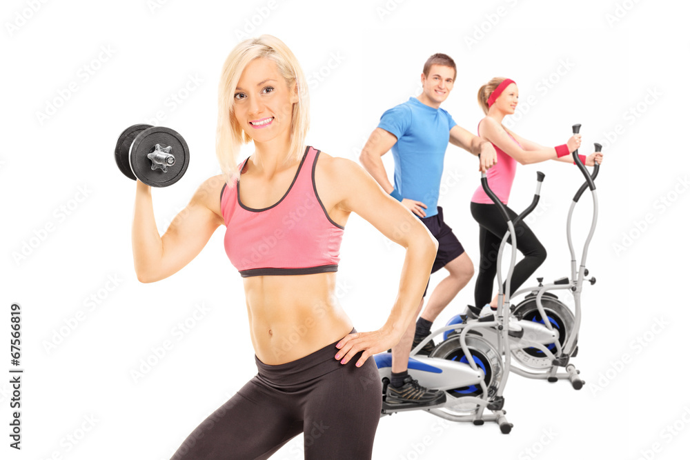 Three athletes exercising with fitness equipment Three athletes exercising with fitness equipment
