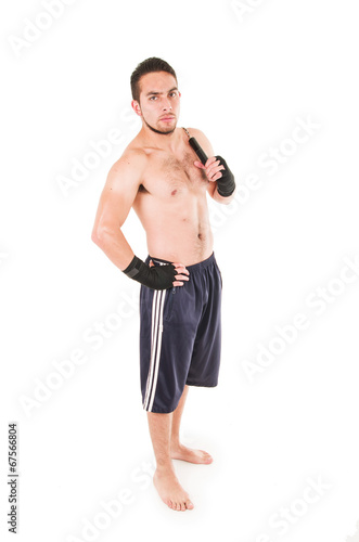 tough martial arts fighter wearing black shorts and wristband photo