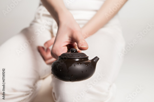 Chinese tea ceremony is perfomed by master photo