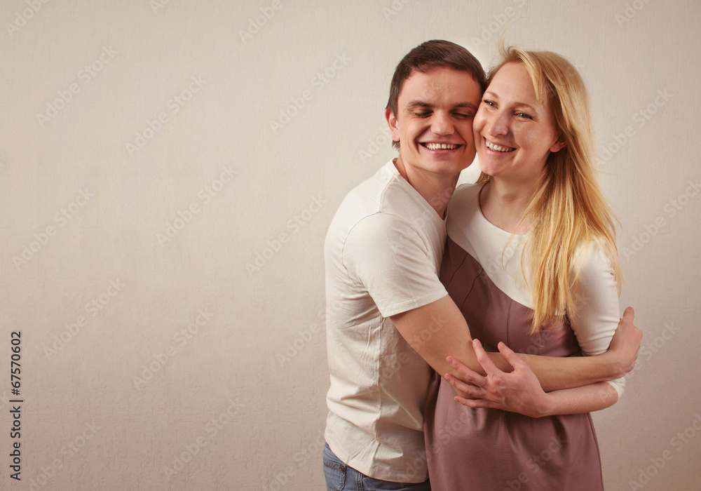 Happy young couple expecting a baby Happy young couple expecting a baby