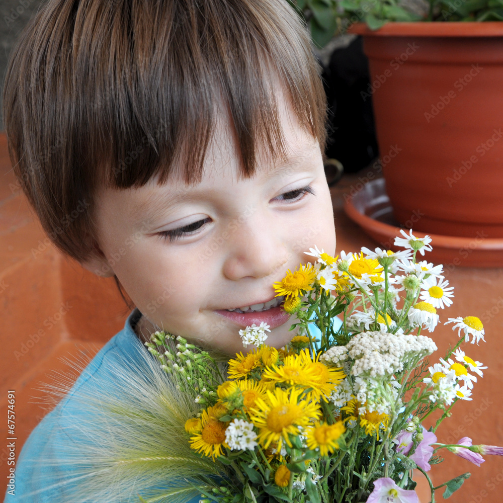 Boy with the bouquet of wildflowers Boy with the bouquet of wildflowers