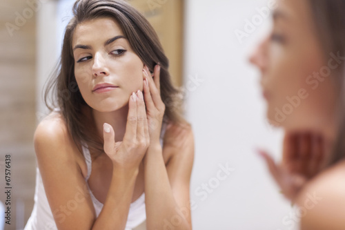 Woman taking care of her skin photo