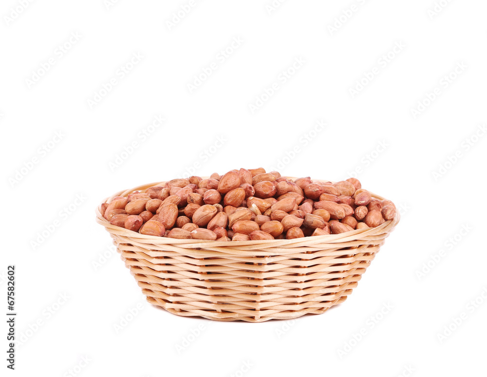 Full wicker basket with peanuts. Full wicker basket with peanuts.