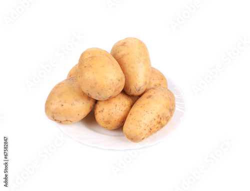 Ripe potatoes on the plate.