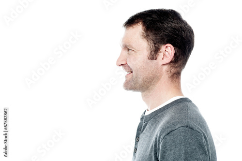 Side view portrait of smiling man