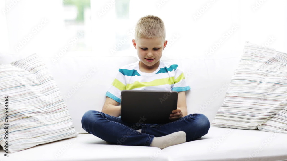 smiling boy with tablet pc computer at home smiling boy with tablet pc computer at home