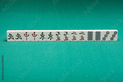 Smooth table surface with a mahjong on it
