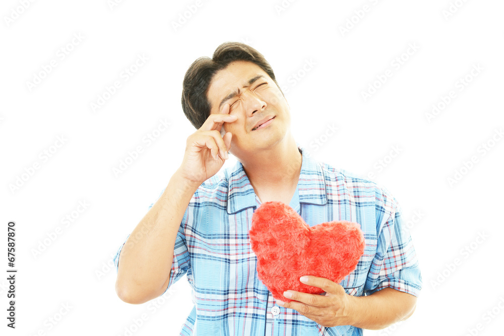 疲れた表情の男性