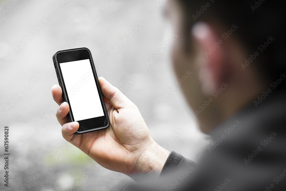 man using mobile smart phone outdoor.