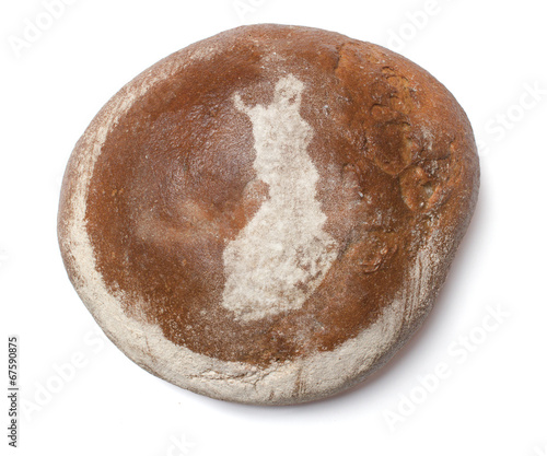 A loaf of fresh bread covered with rye flour in the shape of Fin
