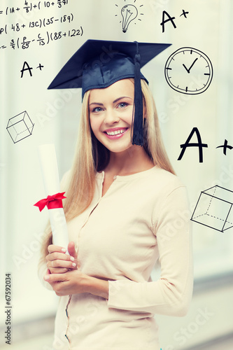 student in graduation cap with certificate photo