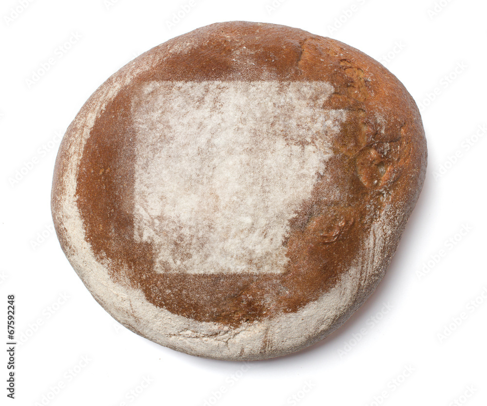 A loaf of fresh bread covered with rye flour in the shape of Ark A loaf of fresh bread covered with rye flour in the shape of Ark