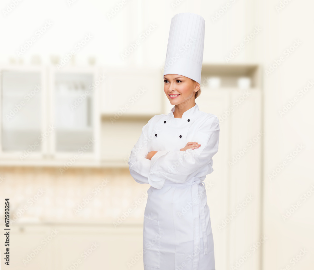 smiling female chef with crossed arms