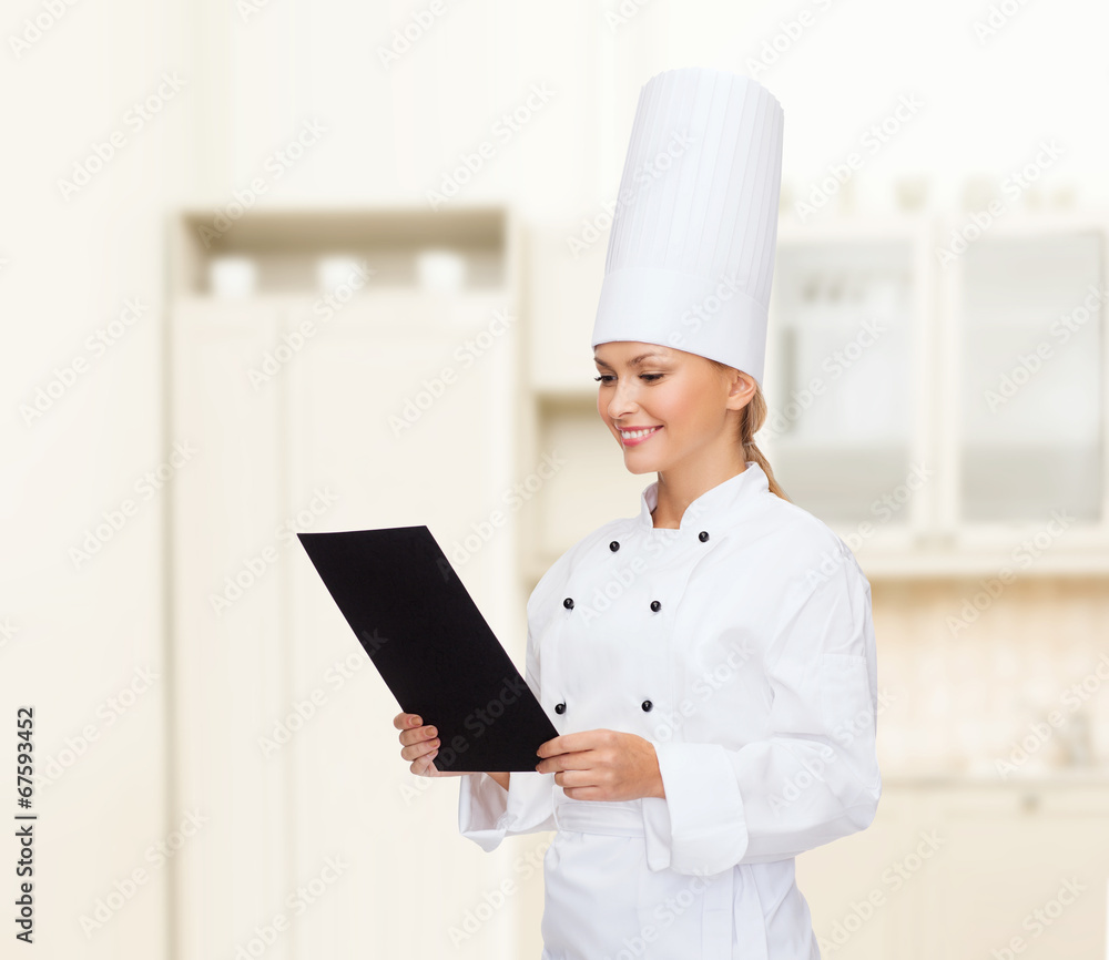 smiling female chef with black blank paper smiling female chef with black blank paper