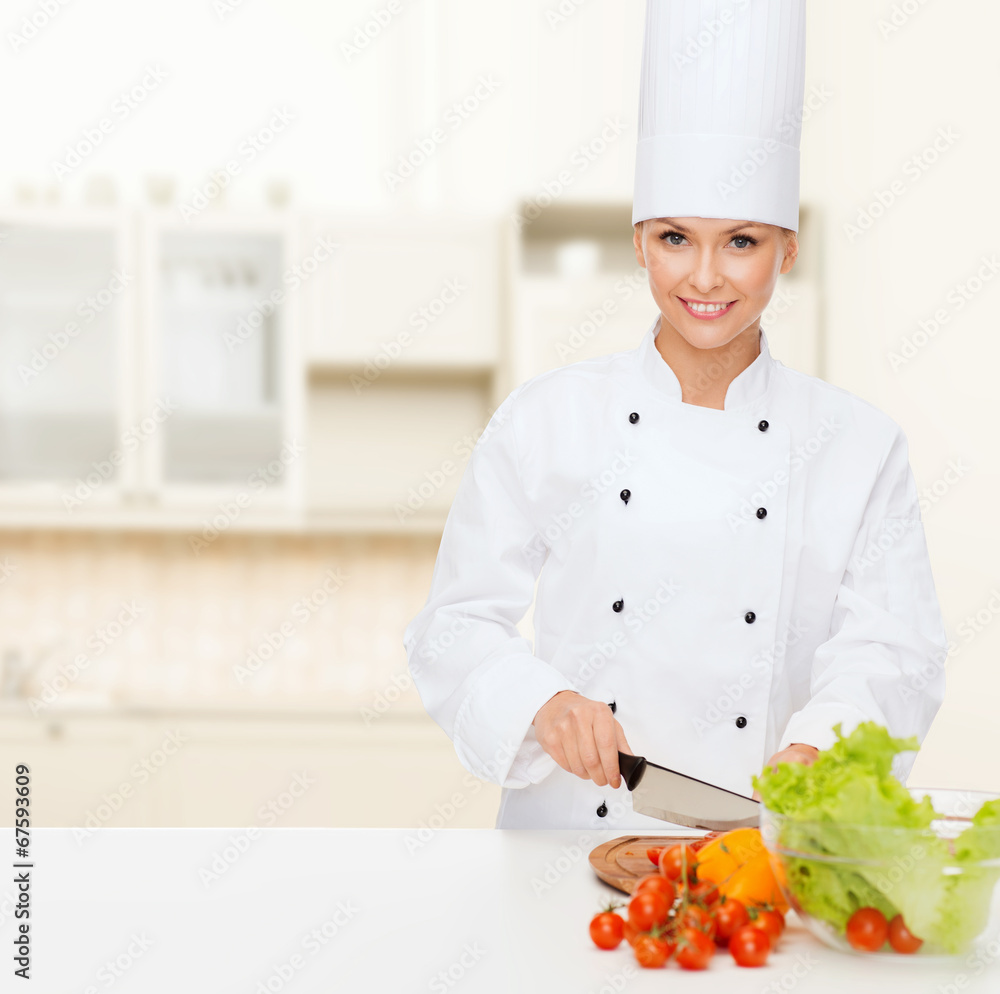 smiling female chef chopping vegetables smiling female chef chopping vegetables