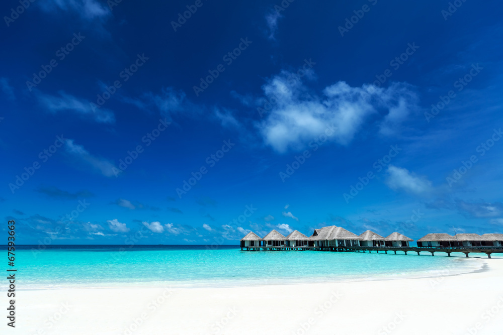 Beautiful beach with water bungalows at Maldives