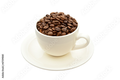 cup with coffee beans on a saucer