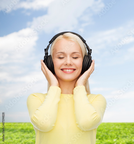 smiling young woman with headphones