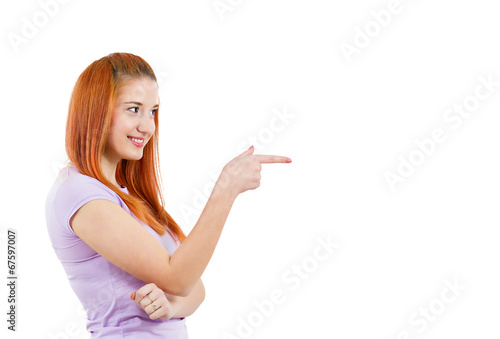 Happy woman pointing finger at someone, picking you