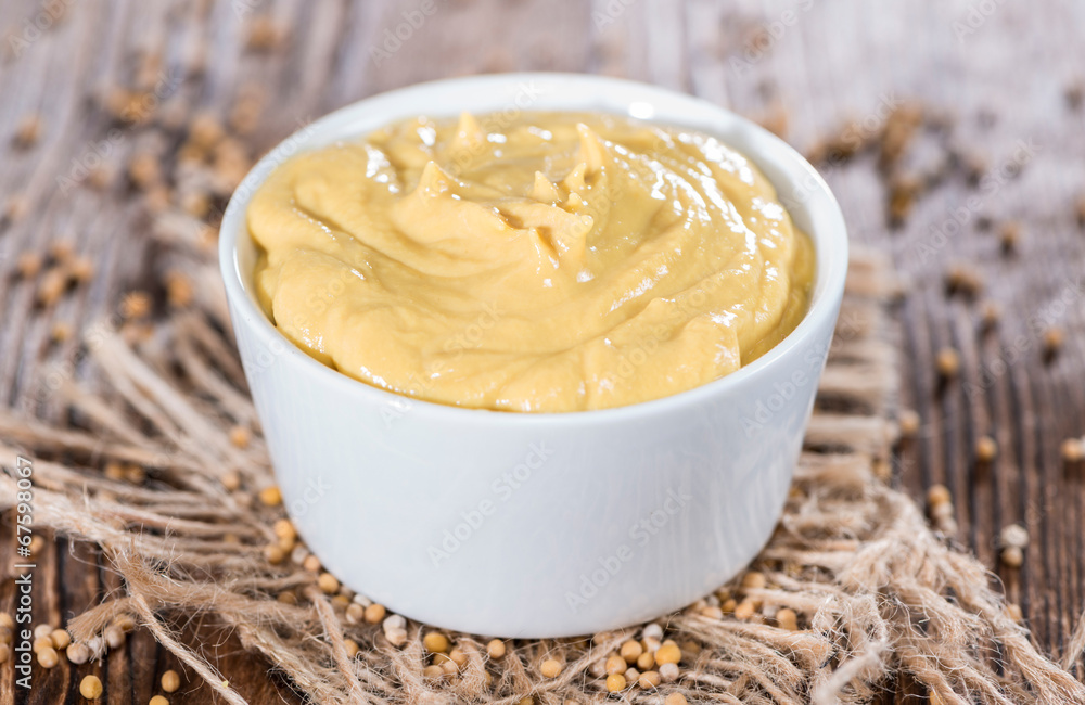 Mustard in a small bowl Mustard in a small bowl