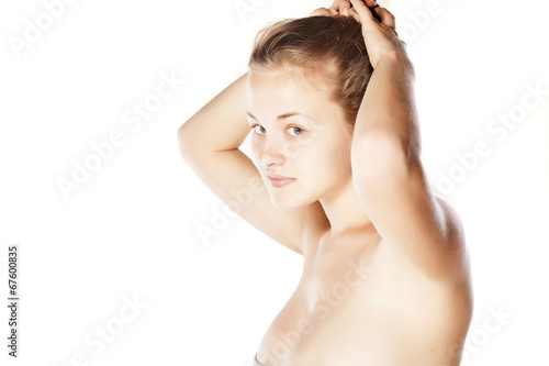 young blonde posing with her hands in her hair