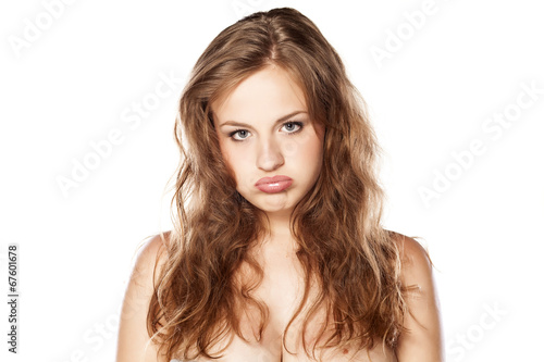 pouting young blonde on white background
