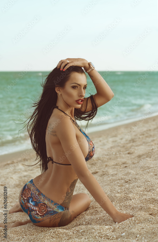 Sexy bikini girl posing at beach Stock Photo | Adobe Stock
