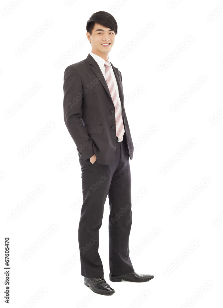 young businessman standing and hands on pocket. young businessman standing and hands on pocket.