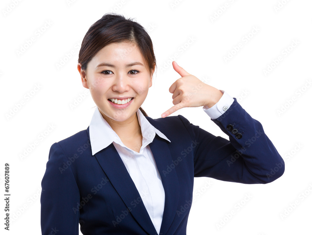 Businesswoman with call gesture