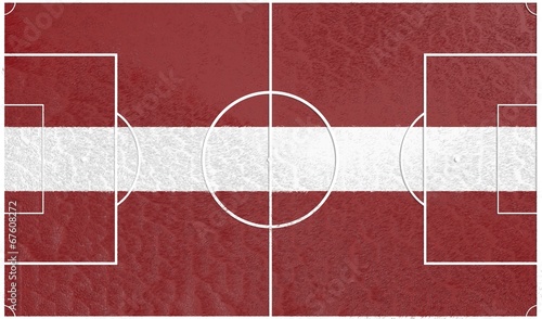 football field textured by latvia national flag