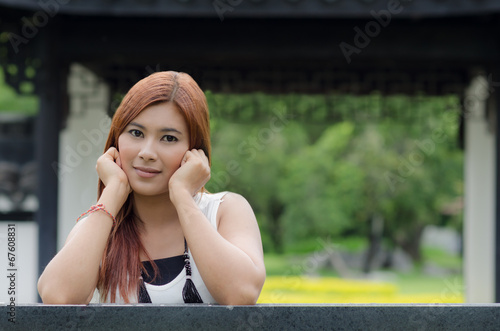 Attractive young redhead Asian woman