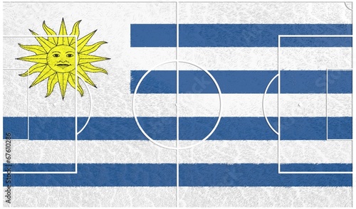 Obraz na płótnie football field textured by uruguay national flag