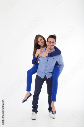 young attractive couple dressed in blue
