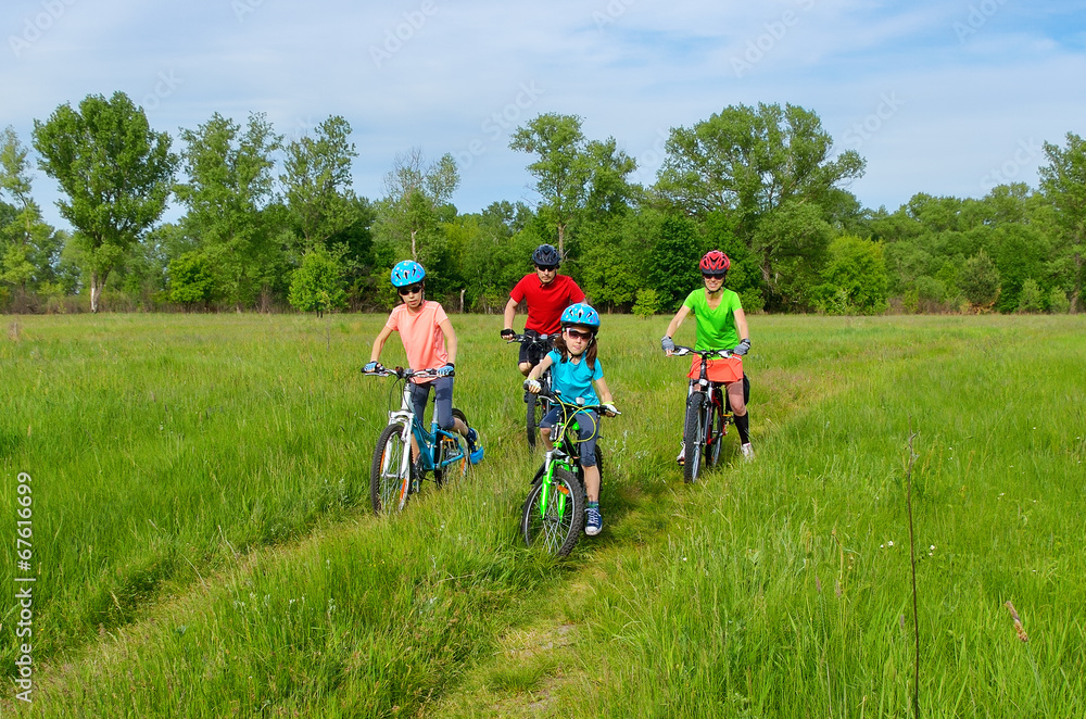Happy family on bikes, cycling with kids Happy family on bikes, cycling with kids