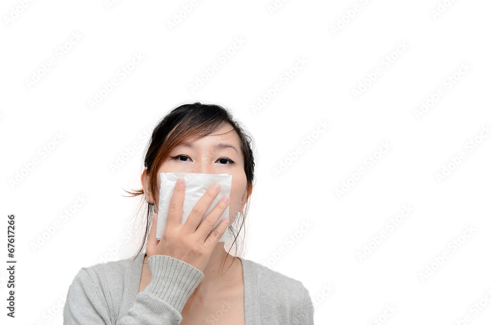 Sick woman blowing her nose isolated. Sick woman blowing her nose isolated.